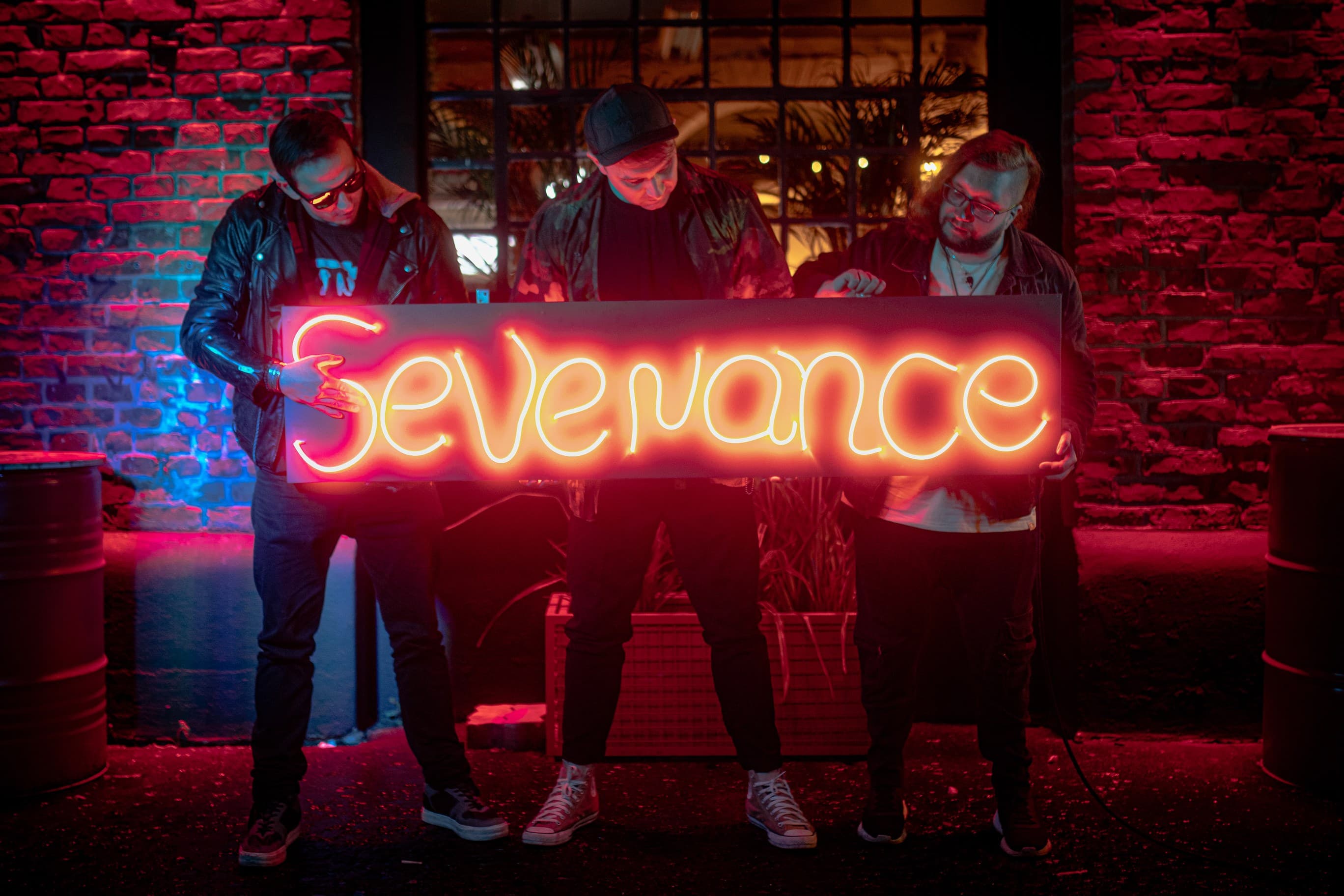 SEVENANCE band with neon sign